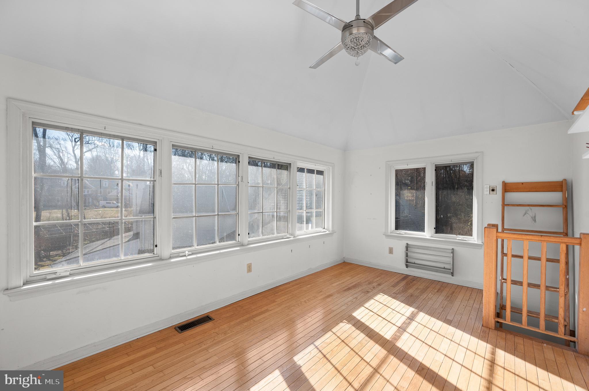 115 Jaffrey Road Malvern, PA 19355 - Photo 42 of 46 a view of an empty room with a window and wooden floor