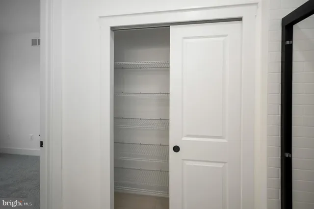 a kitchen with stove and refrigerator