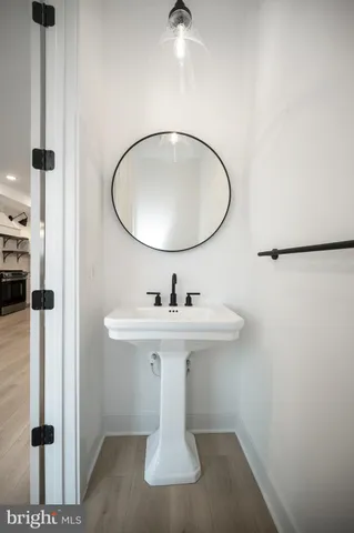 a kitchen with a sink stainless steel appliances and cabinets