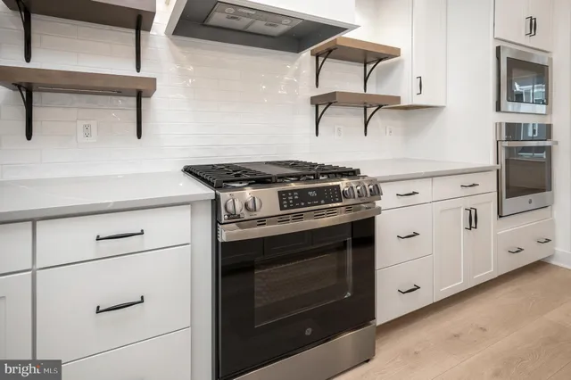 a view of a kitchen with a sink and dishwasher