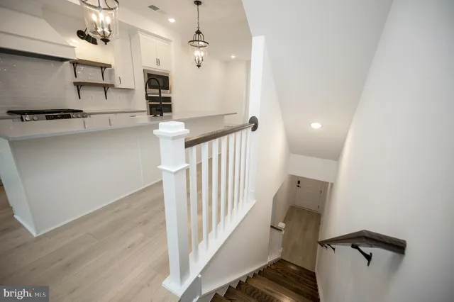a view of a dining room with furniture and a potted plant