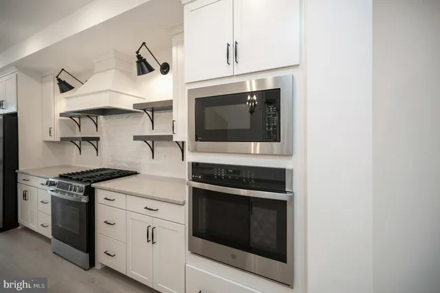 a view of a kitchen cabinets and wooden floor