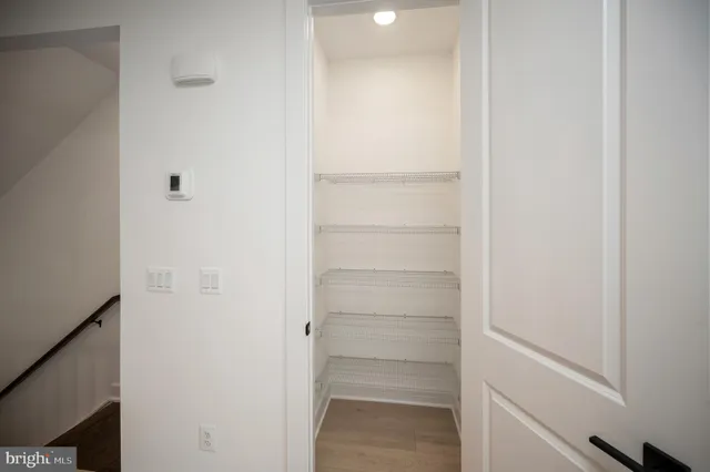 wooden floor in a room next to a window