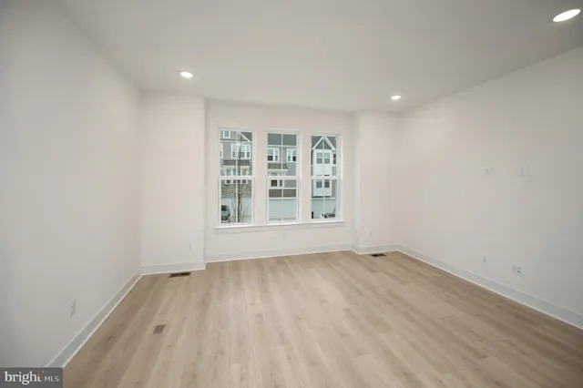 a view of kitchen with furniture and wooden floor