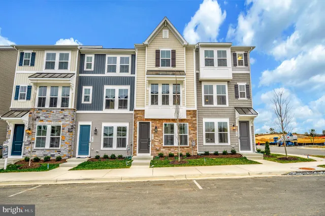 a front view of a residential apartment building with street view