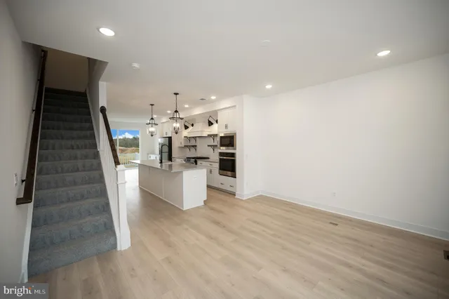 a view of a balcony with wooden floor and city view