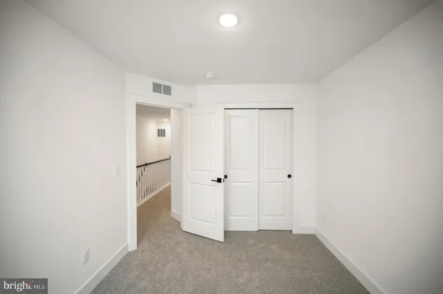 a view of staircase with a rug and a porch