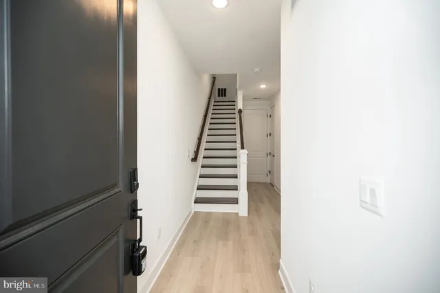 a view of a hallway with stairs