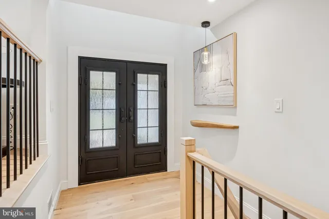 a view of a dining room with furniture and a chandelier