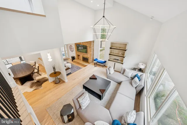 a view of a dining room with furniture and a large window