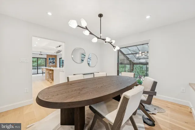 a spacious bedroom with a bed and a dresser