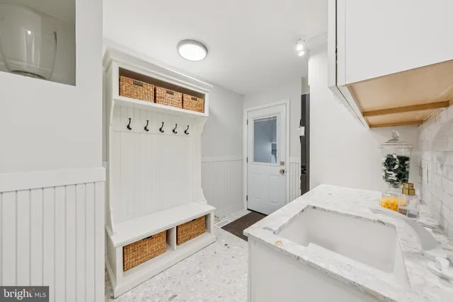 a bathroom with a sink vanity and a mirror
