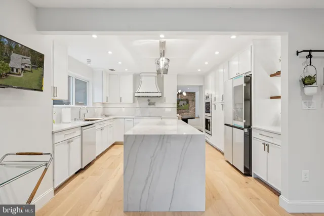 a bathroom with a granite countertop sink mirror and