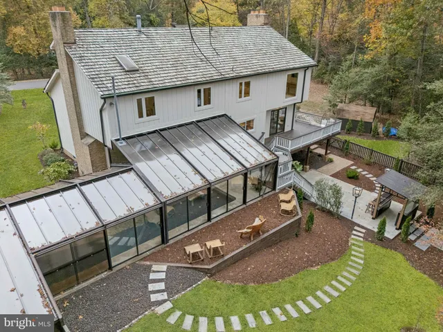 an aerial view of a house with a garden
