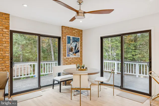 a white bath tub sitting next to a white sink