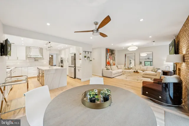 a bathroom with a double vanity sink mirror and toilet