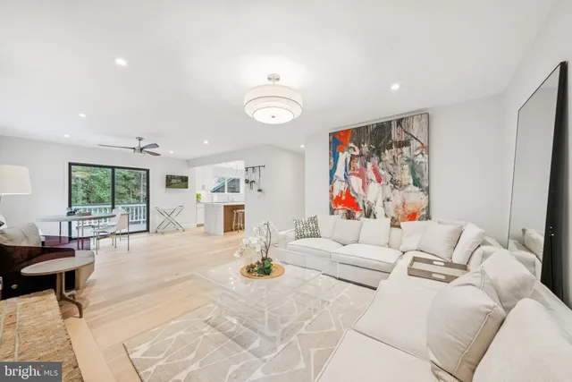 a bedroom with a large bed and a potted plant