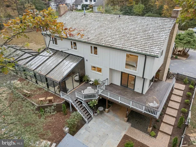 an aerial view of a house with outdoor space