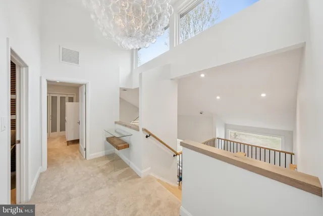 a living room with furniture a fireplace and a large window