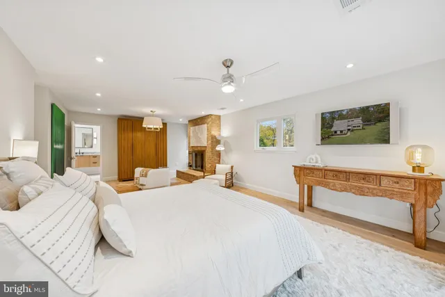 a view of a chairs and tables in the back yard of the house