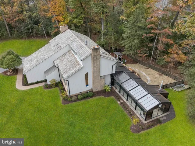 an aerial view of a house with outdoor space