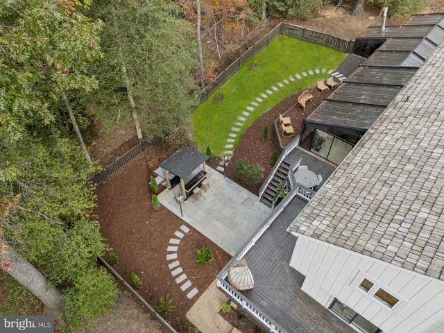 a aerial view of a house with a yard