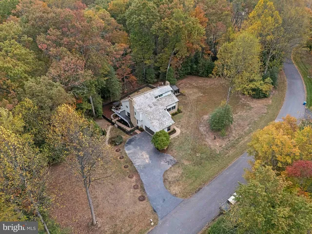 a living room with furniture a rug and a large window