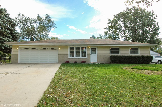 425 Bode Road Hoffman Estates, IL 60169 - Photo 1 of 11 a view of a house with a back yard