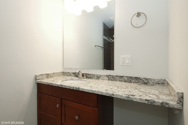 425 Bode Road Hoffman Estates, IL 60169 - Photo 5 of 11 a bathroom with a granite countertop sink and a mirror