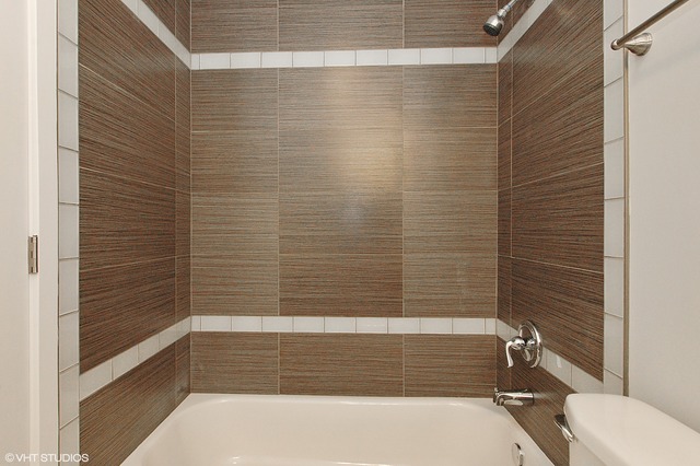 425 Bode Road Hoffman Estates, IL 60169 - Photo 6 of 11 a bathroom with a shower and a toilet