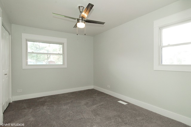 425 Bode Road Hoffman Estates, IL 60169 - Photo 8 of 11 an empty room with a window