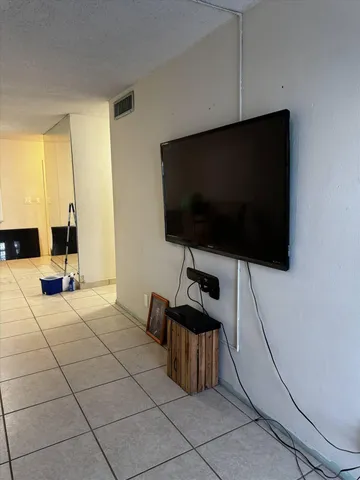 a bedroom with a bed and a mirror