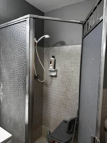 a view of a room with wooden floor