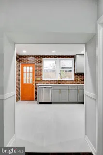 a kitchen with stainless steel appliances a refrigerator and a sink