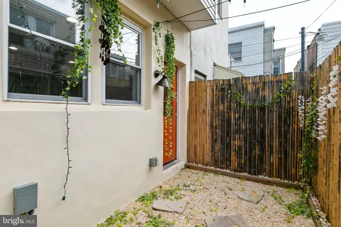 a view of a wooden door with a house
