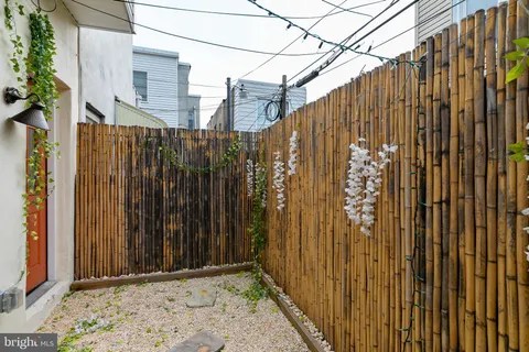 a view of a wooden fence with a chair