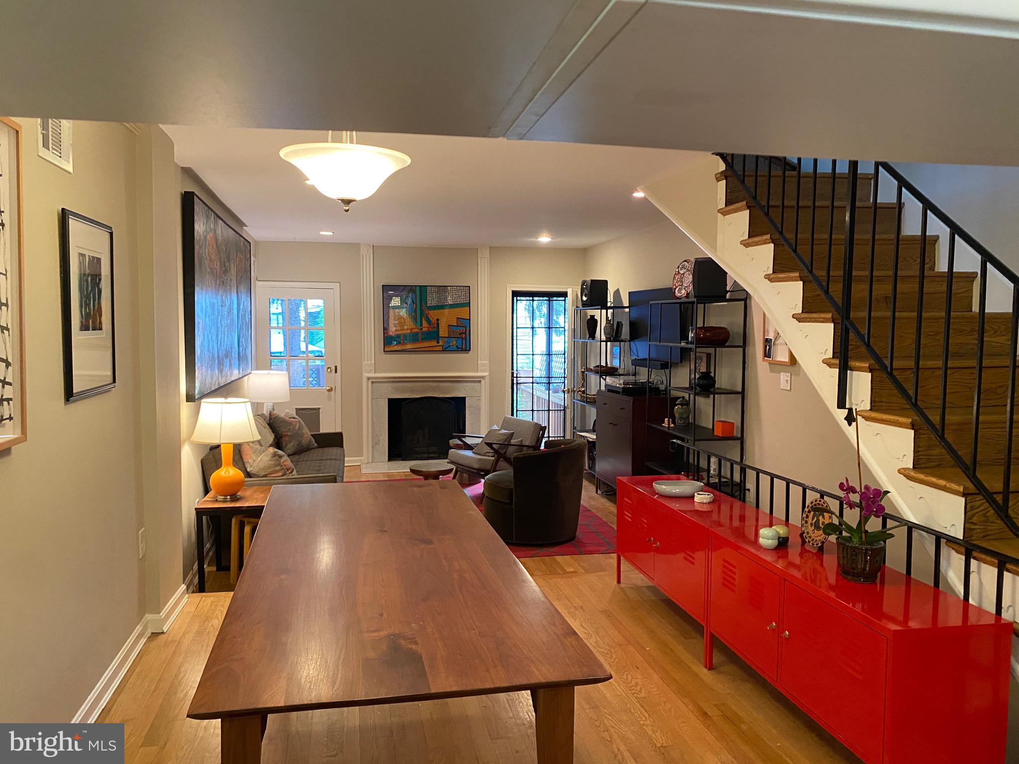 339 11th Street Southeast Washington, DC 20003 - Photo 28 of 39 a living room with furniture and a fireplace