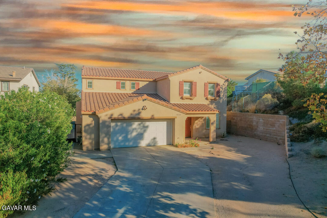 38318 Wakefield Place Palmdale, CA 93551 - Photo 1 of 33 front view of a house with a yard