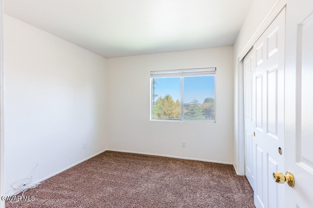 38318 Wakefield Place Palmdale, CA 93551 - Photo 18 of 33 an empty room with a window