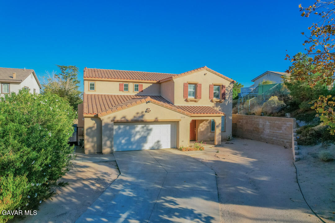 38318 Wakefield Place Palmdale, CA 93551 - Photo 2 of 33 front view of a house with a yard