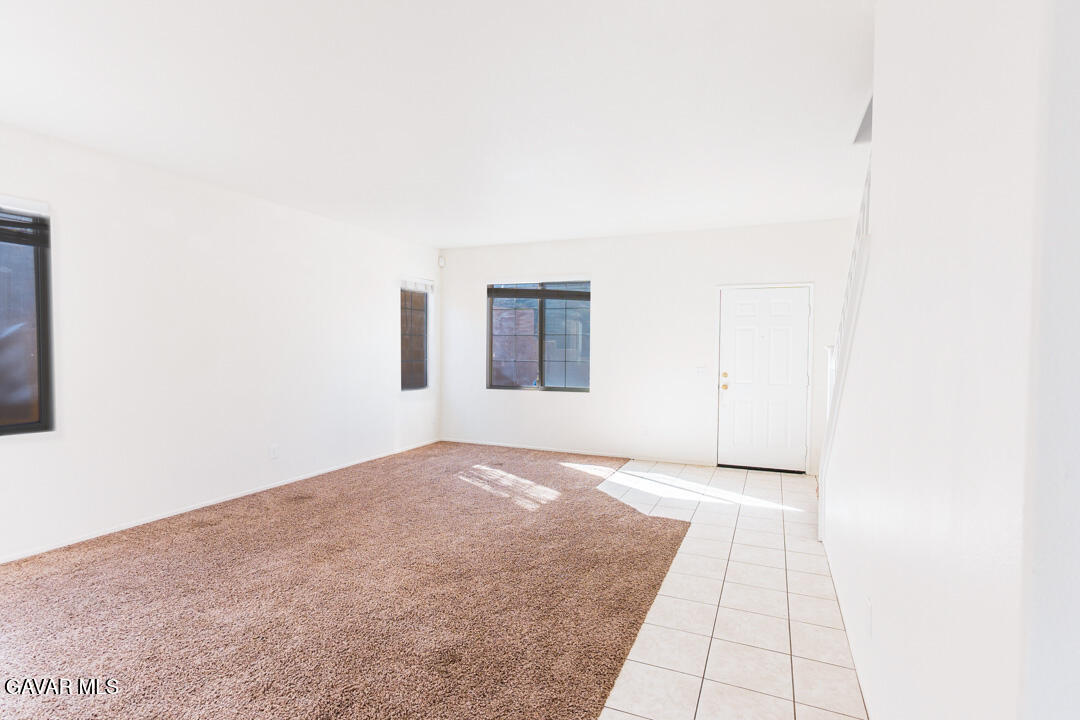 38318 Wakefield Place Palmdale, CA 93551 - Photo 4 of 33 a view of an empty room with windows