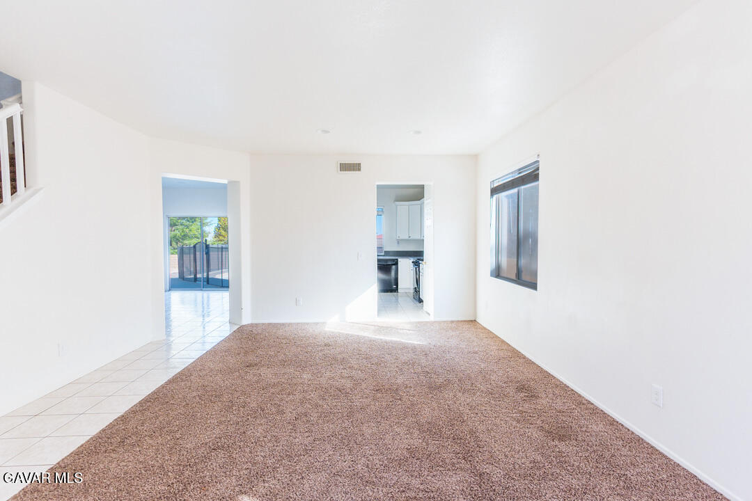38318 Wakefield Place Palmdale, CA 93551 - Photo 7 of 33 an empty room with windows and entrance