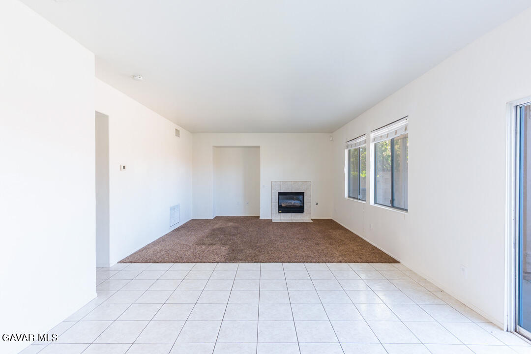 38318 Wakefield Place Palmdale, CA 93551 - Photo 10 of 33 an empty room with windows