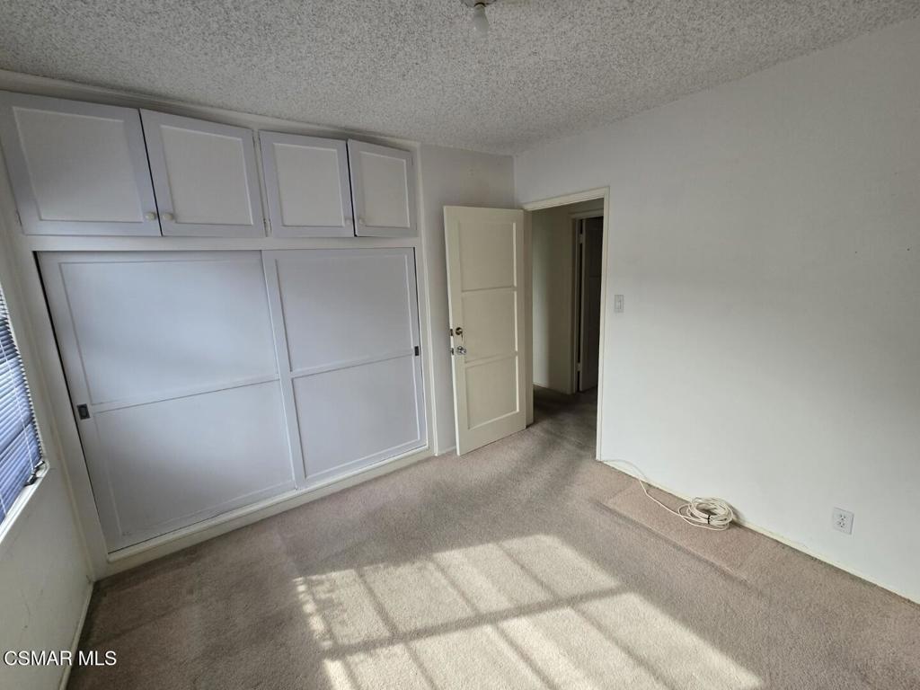 17526 Miranda Street Encino, CA 91316 - Photo 12 of 28 a view of a closet area with hallway