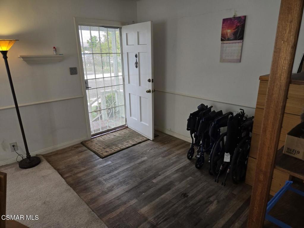 17526 Miranda Street Encino, CA 91316 - Photo 3 of 28 a view of a hallway with wooden floor and a window