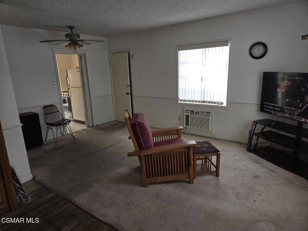 17526 Miranda Street Encino, CA 91316 - Photo 4 of 28 a living room with furniture and a flat screen tv
