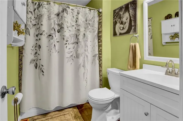 a bathroom with a toilet and a sink