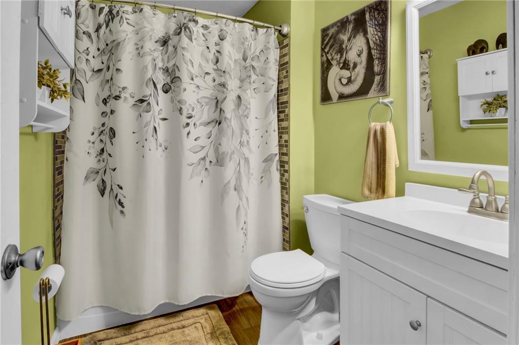 4947 Holbrook Circle Northwest Duluth, GA 30096 - Photo 12 of 26 a bathroom with a toilet and a sink