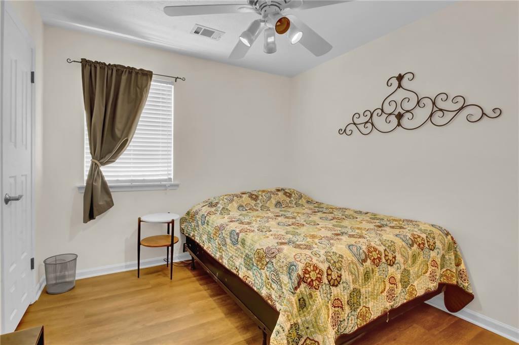 4947 Holbrook Circle Northwest Duluth, GA 30096 - Photo 16 of 26 a bedroom with a bed and a window