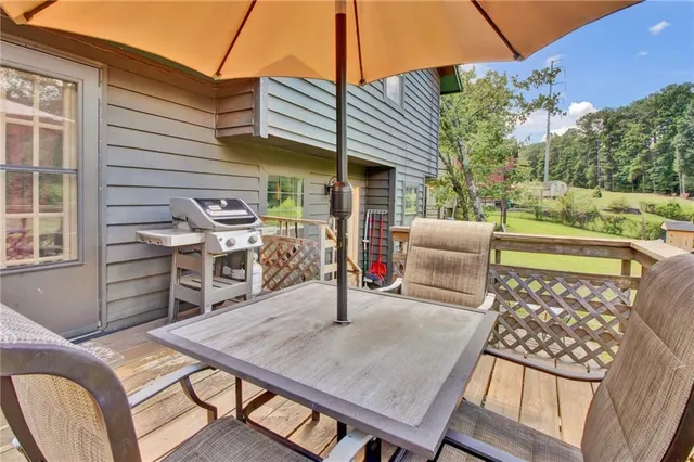 a view of a patio with table and chairs and potted plants